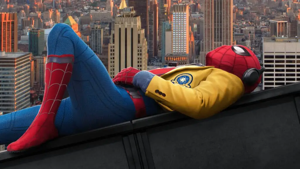 Spider man lying down wearing a men's yellow jacket.