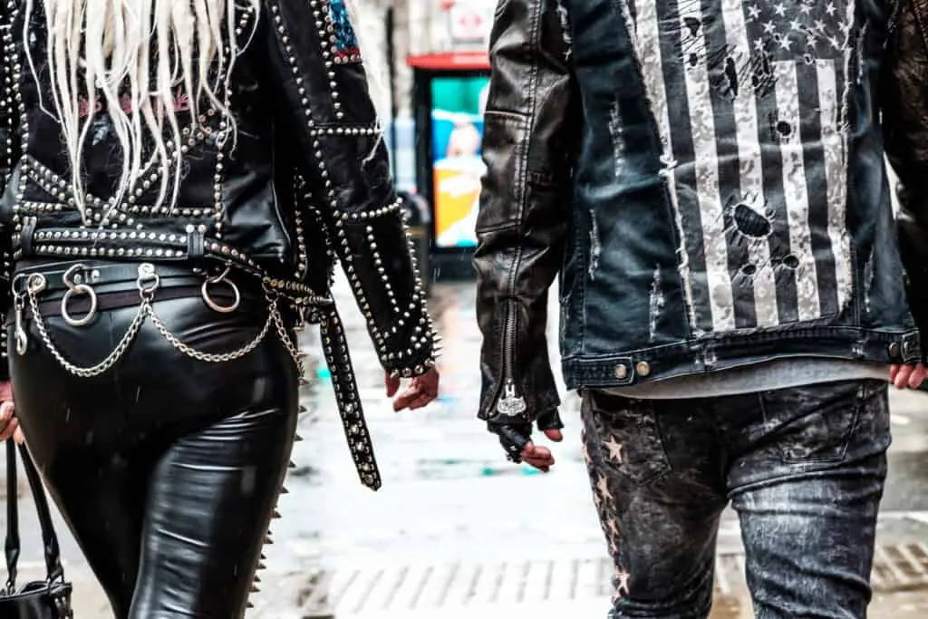 Close up of couple's back wearing leather jackets with lot's of studs and design.