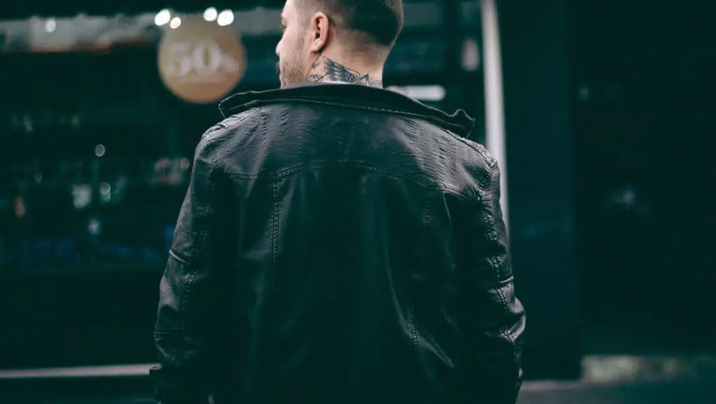 Man wearing a leather jacket.