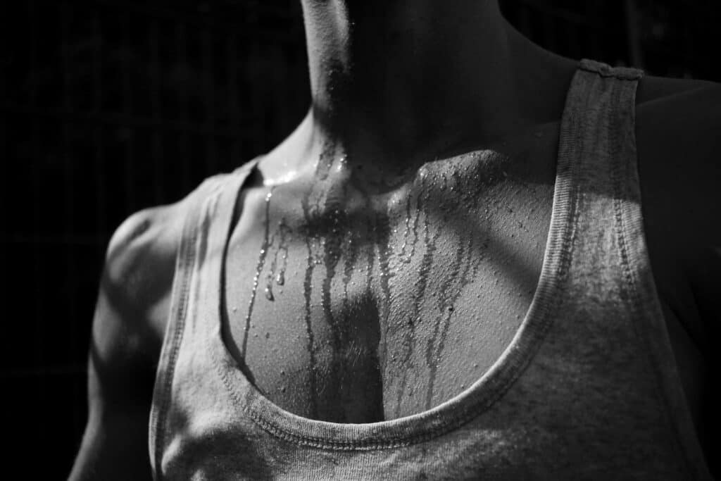 man sweating wearing cotton tank top