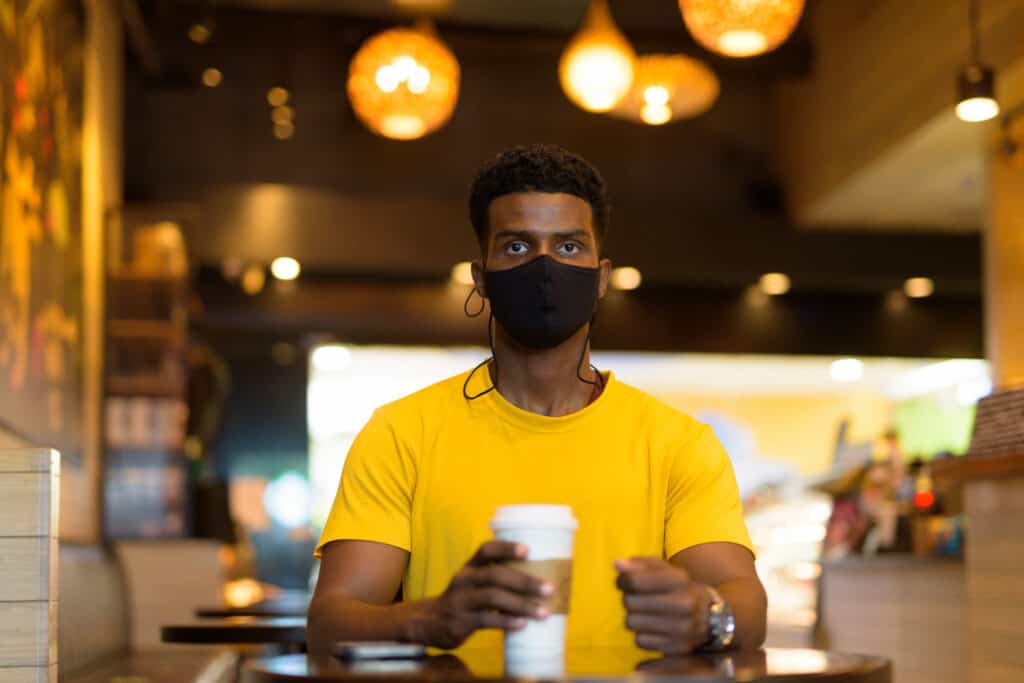 Man wearing yellow shirt